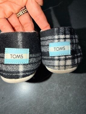 TOMS Black & White Plaid Slip-On Shoes with Light Blue Logo